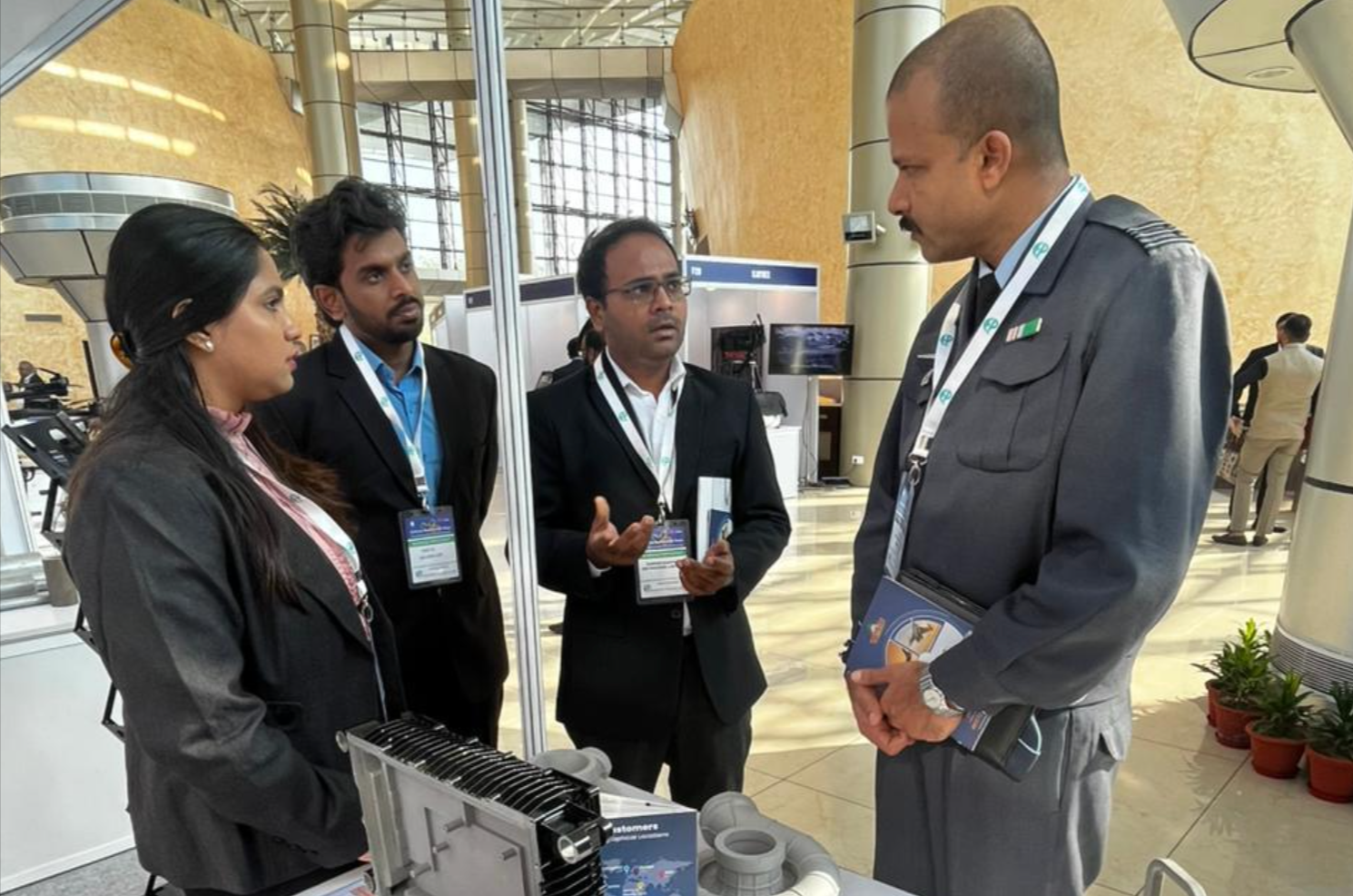 Neterwala Group representatives engage in a detailed discussion with a defence officer at their boot