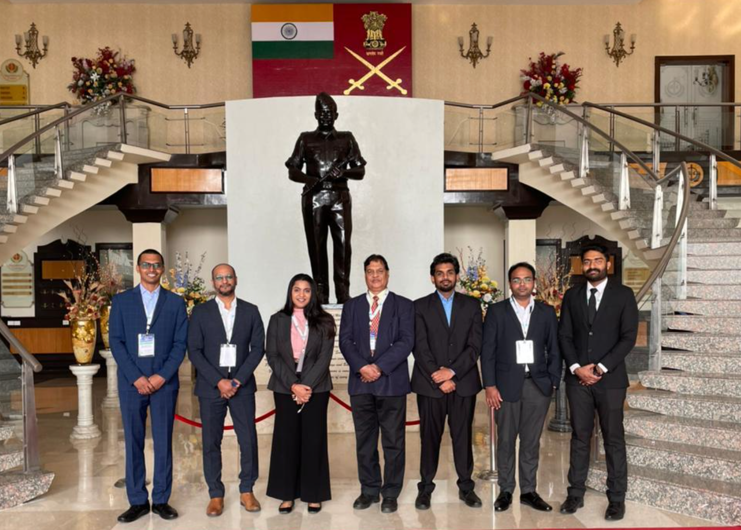 Neterwala Group team poses at the IMR Defence Partnership Days 2024 in front of a statue at the Manekshaw Centre, New Delhi.